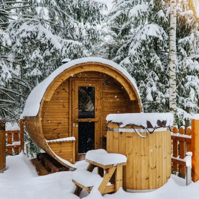 Winter Wonderland Snow-Covered Barrel Sauna