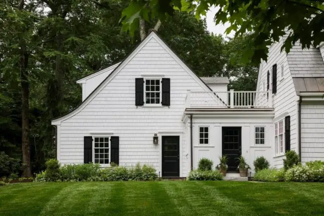 Cottage-Style White House with Black Shutters