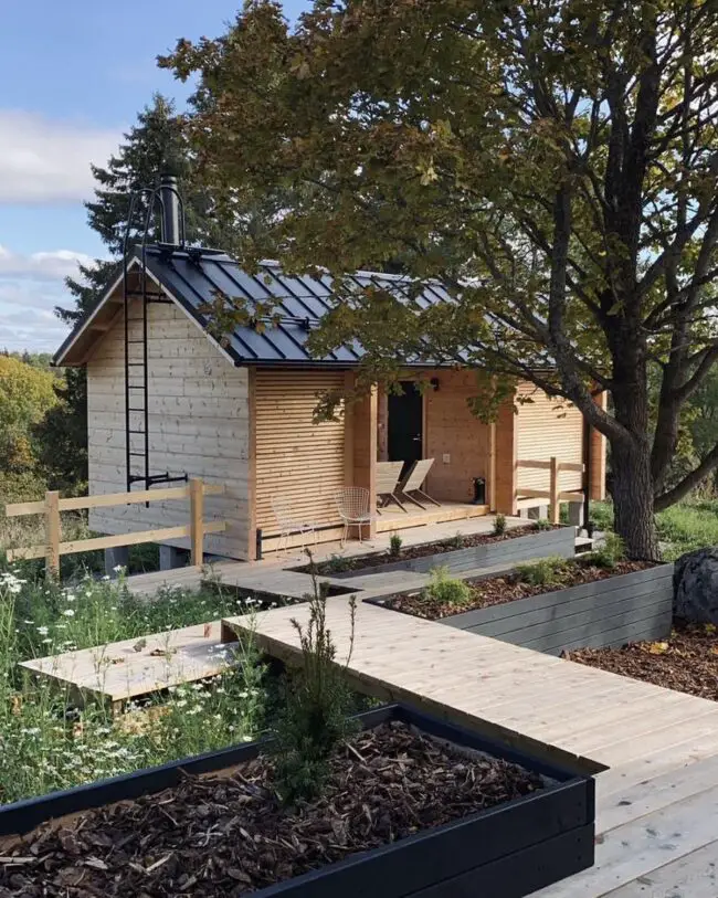 Quaint Sauna Cabin with a Garden Path