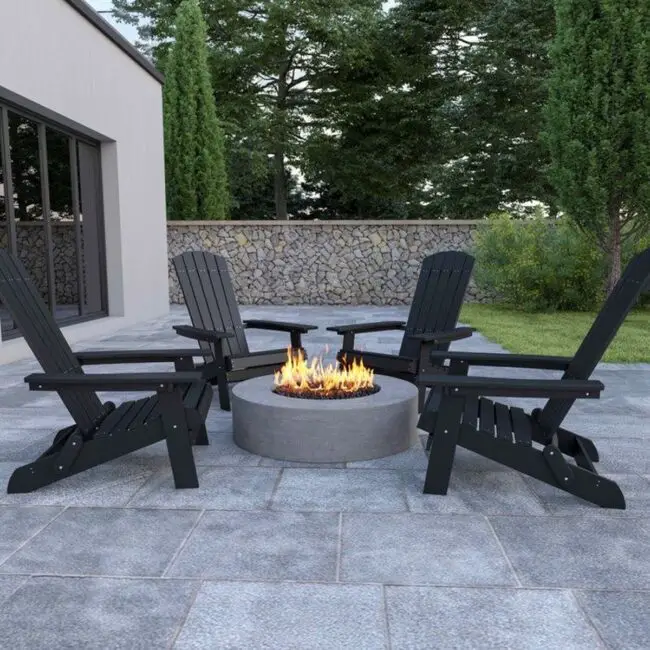 Black Adirondack Chairs Around a Sleek Fire Pit