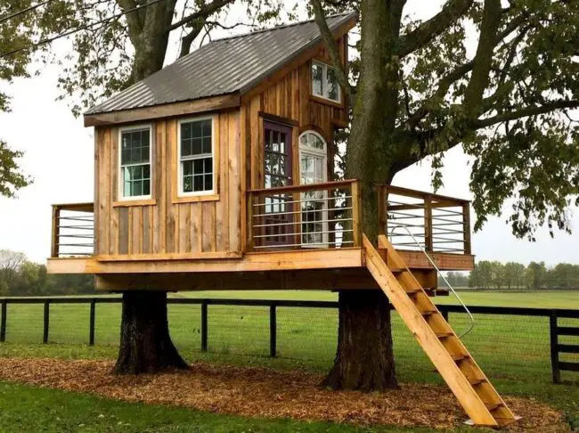 Rustic Treehouse with a Durable Metal Roof