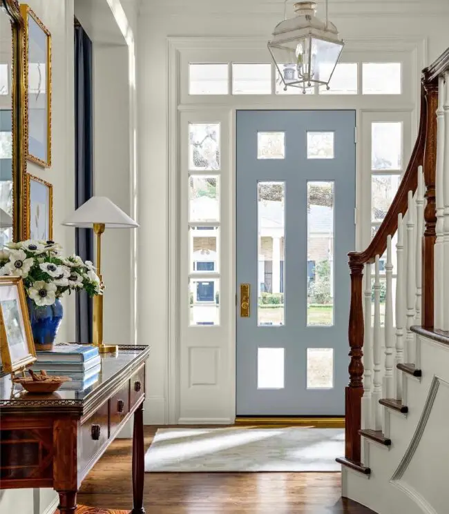 Stylish Entryway with a Soft Blue Door