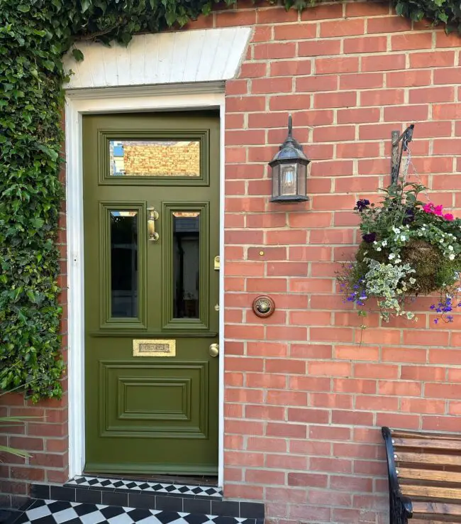 Elegant Green Door with Luxurious Gold Accents