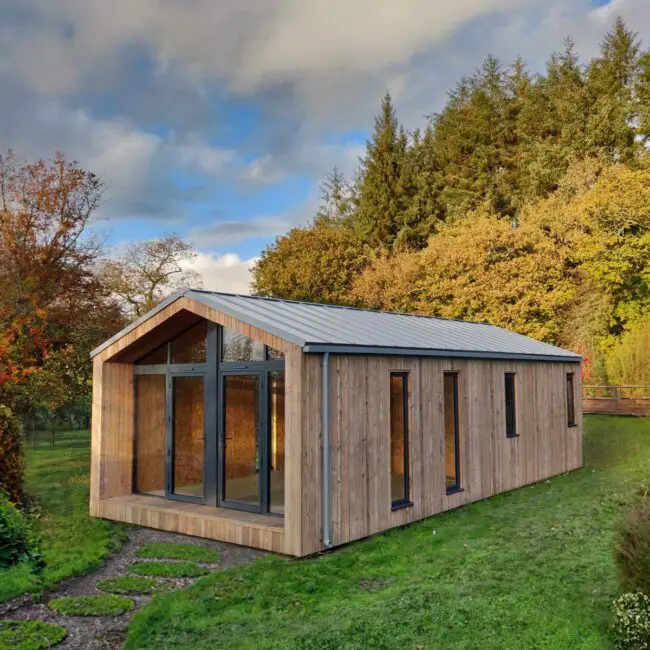 Nature-Inspired Wood Cabin with Glass Front