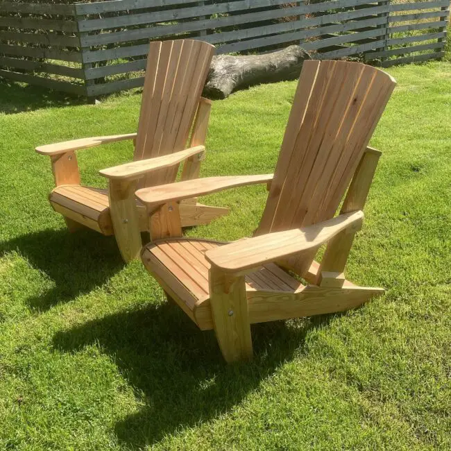 Twin Wooden Adirondack Chairs in a Sunny Backyard