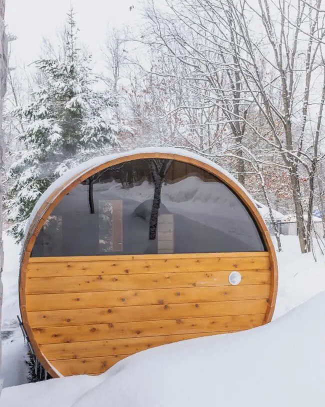 Snow-Blanketed Barrel Sauna Retreat