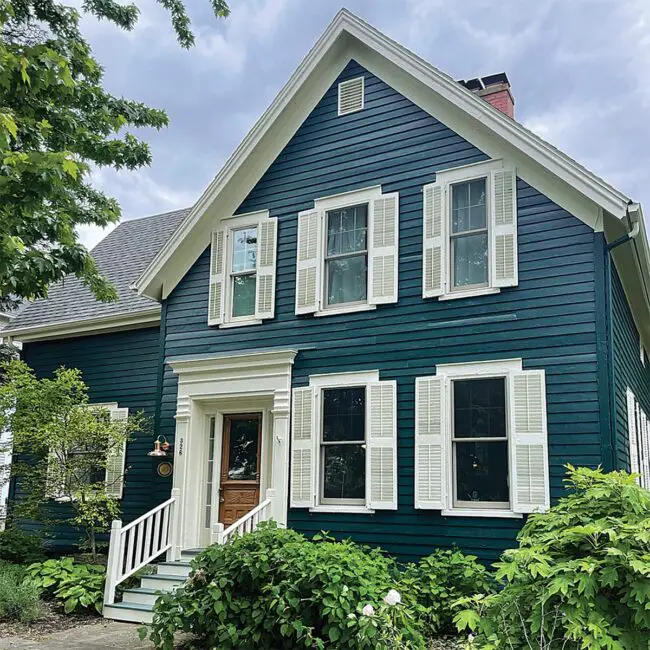 Navy Home with Classic White Shutters