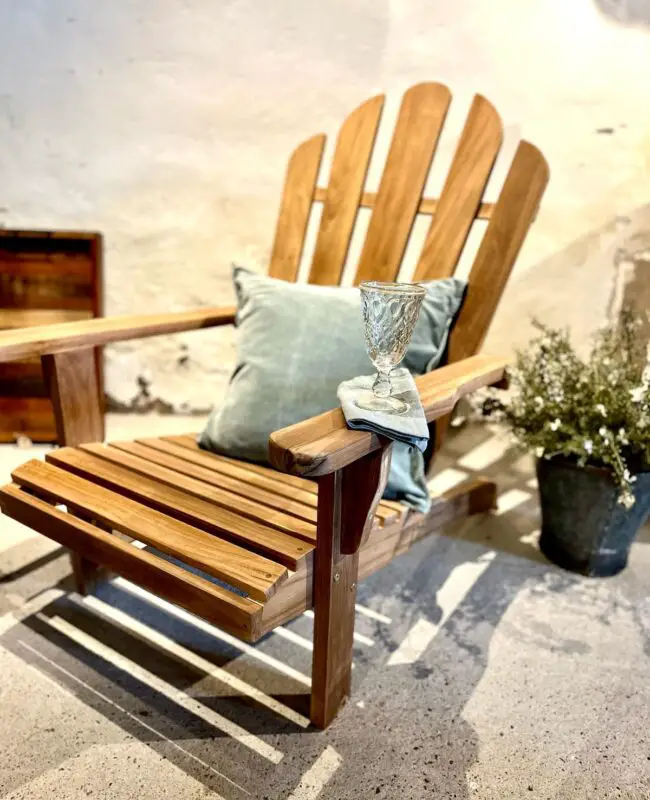 Wooden Adirondack Bench in a Courtyard