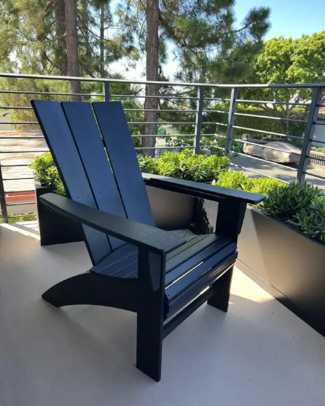 Black Adirondack Chair on a Modern Balcony