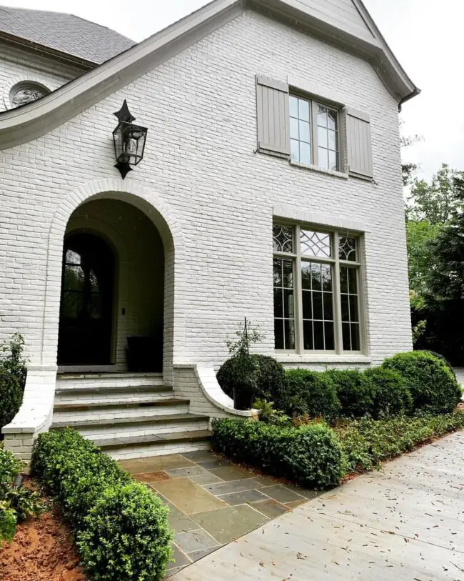 White Brick House with Arched Entry