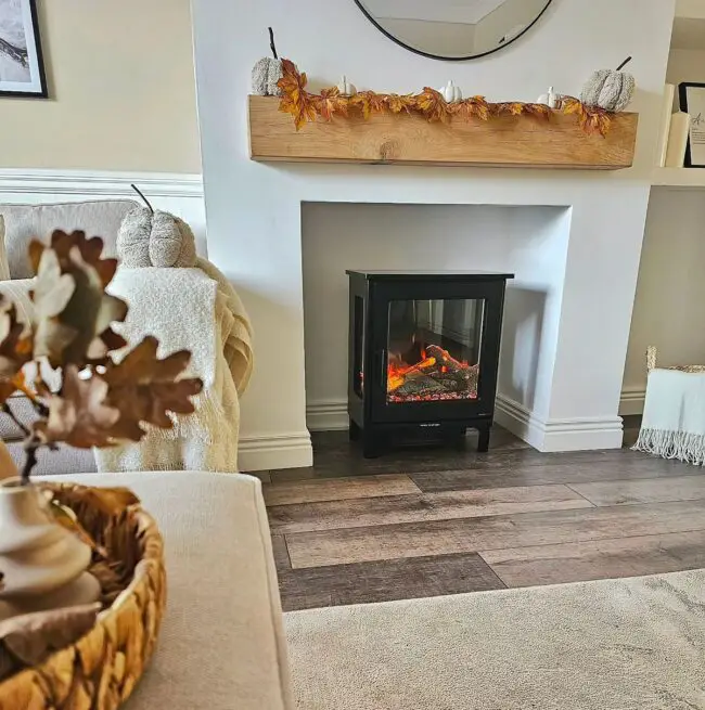 Cozy Fireplace Mantel Adorned with Autumn Leaves