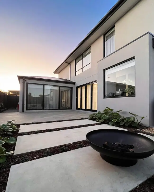 Modern Concrete Patio Featuring a Fire Pit