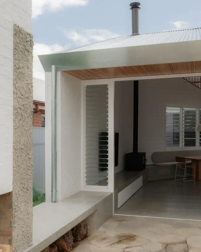 Minimalist Concrete Porch with Integrated Bench