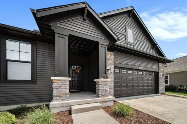 Modern Elegance with Stone and Dark Siding