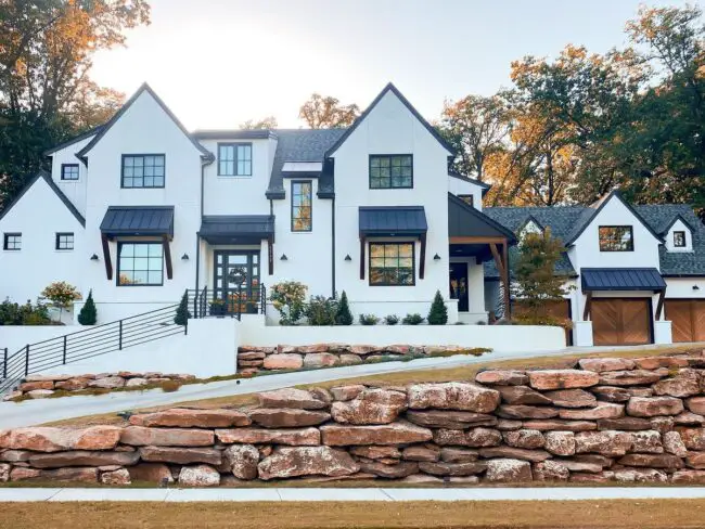 Grand White House with Stone Landscaping