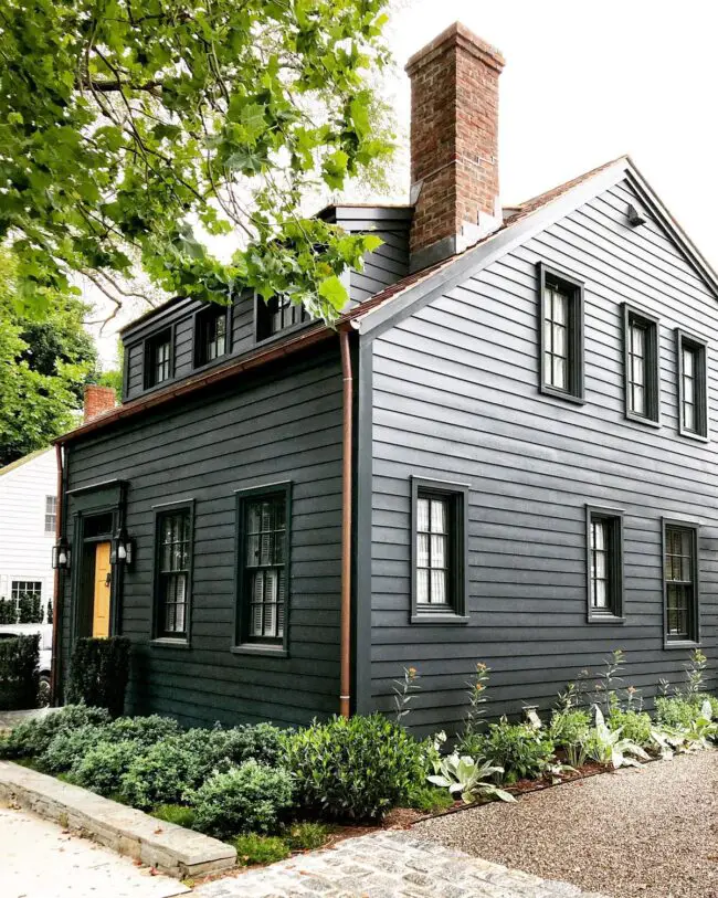 Timeless Cottage with Dark Siding and Brick Details