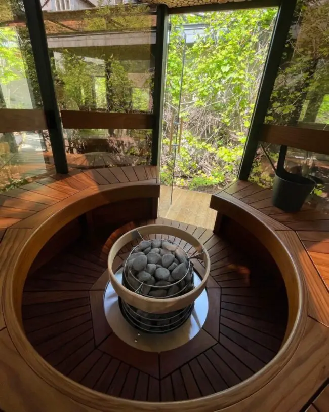 Glass-Walled Circular Sauna for Open Views